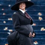 Rihanna at the Met Gala in a black suit and wide-brimmed hat.