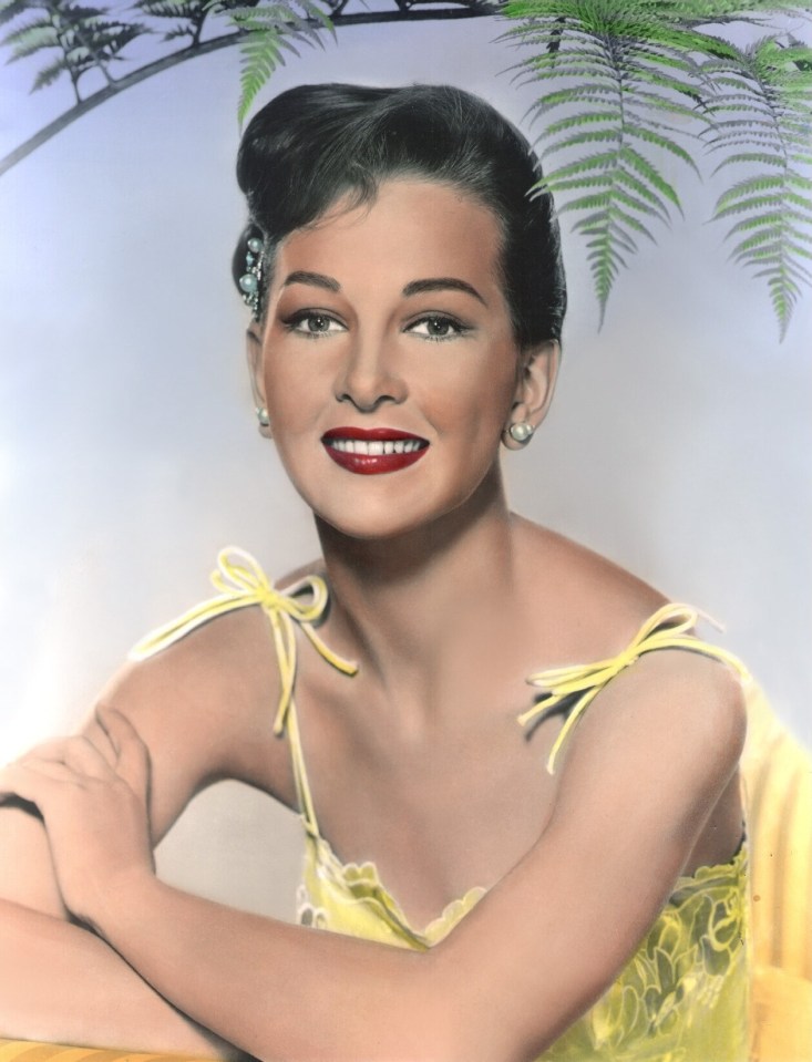 Portrait of Taina Elg in a yellow dress.