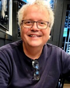 Portrait of a man smiling.