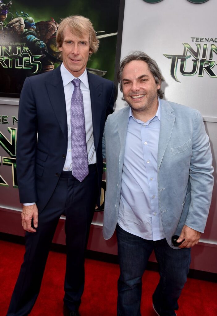 WES Producer Michael Bay (L) and Paramount Film Group President Adam Goodman attend the premiere of Paramount Pictures' "Teenage Mutant Ninja Turtles" at Regency Village Theater on August 3, 2014