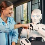 Robot-and-woman-working-on-laptop