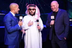 Jon Anik, Turki Alalshikh, and Dana White at a UFC event.