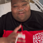 Dave Blunt in a hospital bed, announcing a tour cancellation due to health reasons.