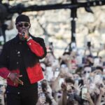 Werenoi performing on stage at a music festival.