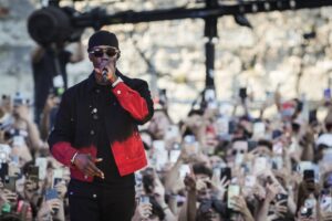 Werenoi performing on stage at a music festival.