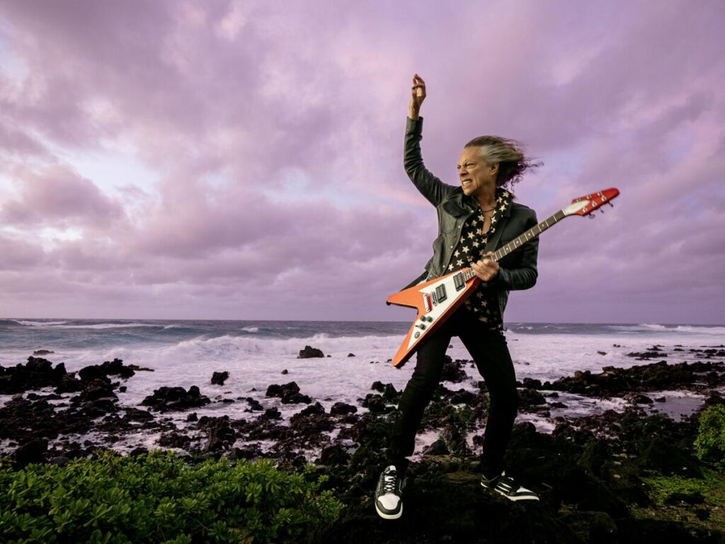 Hammett pictured with his Gibson Flying V guitar, a "made-to-measure" instrument created for him by the specs he requested.