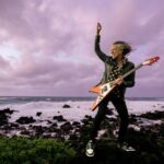 Hammett pictured with his Gibson Flying V guitar, a "made-to-measure" instrument created for him by the specs he requested.
