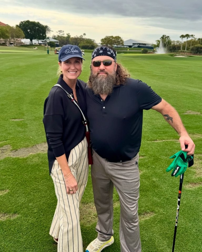 Korie and Willie Robertson on a golf course.