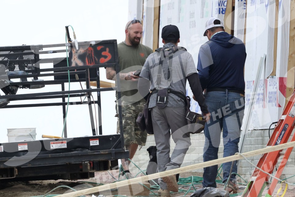 Adam Lind, Chelsea Houska's ex, at a job site with his dog.