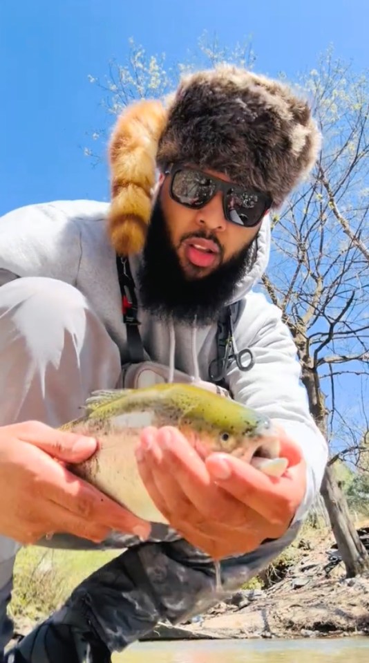 Man holding a trout.