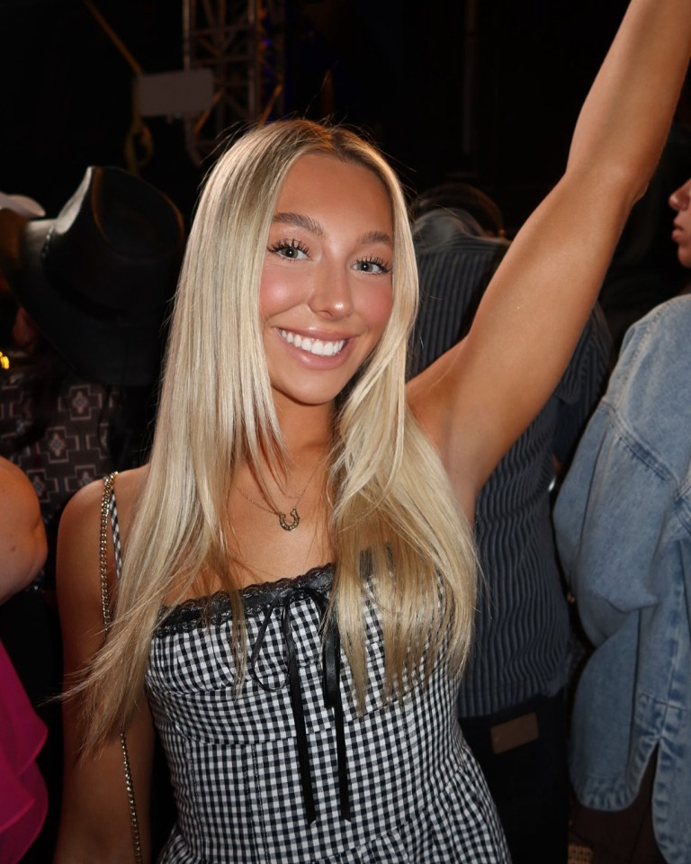 Woman with blonde hair and a gingham dress.
