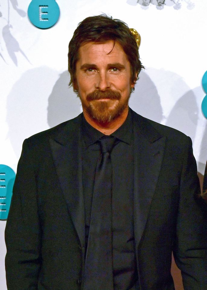 Headshot of Christian Bale in a black suit.