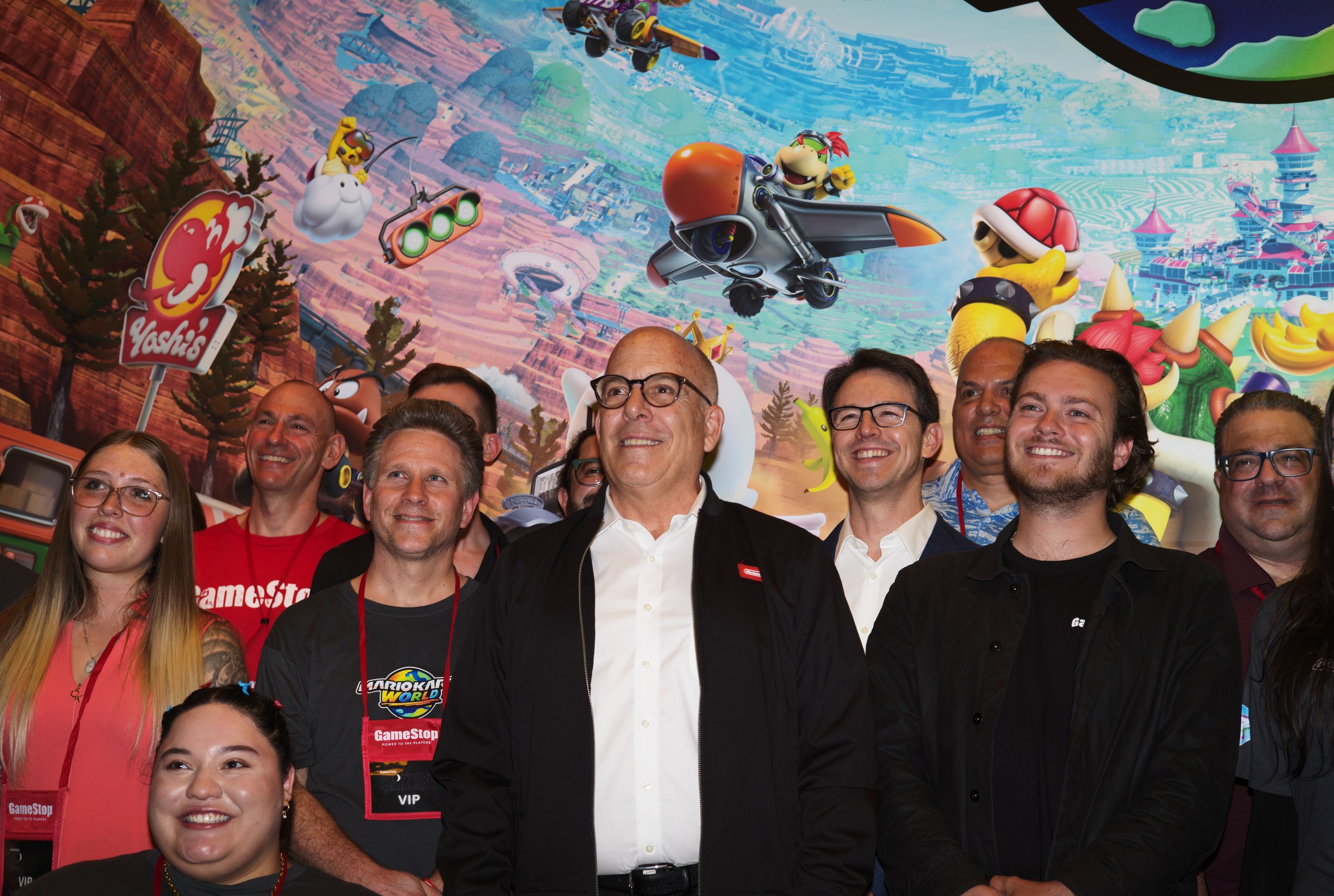 Doug Bowser (center) poses with Gamestop staff.