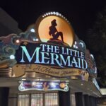The new Little Mermaid live show marquee at night at Hollywood Studios