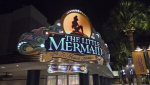 The new Little Mermaid live show marquee at night at Hollywood Studios