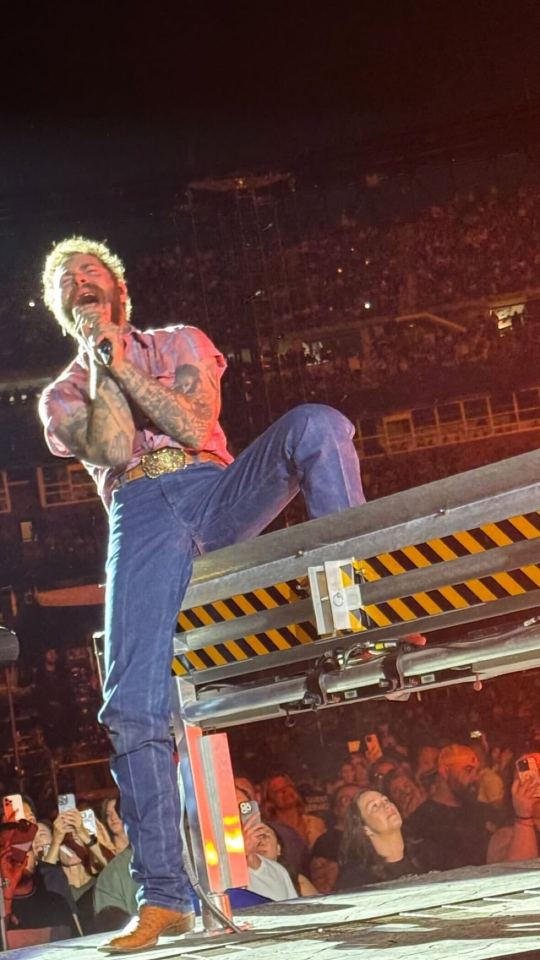Post Malone performing on stage.