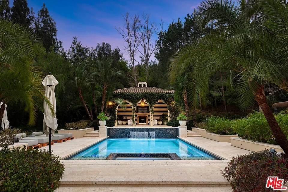 Rob Kardashian's Hidden Hills mansion pool area at dusk.