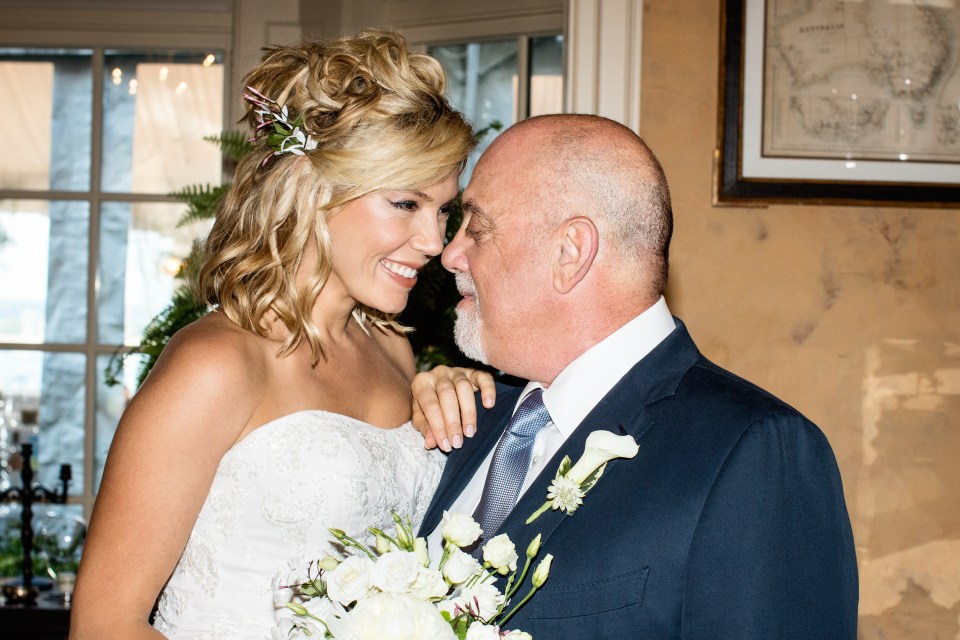 Bride and groom sharing a tender moment at their wedding.