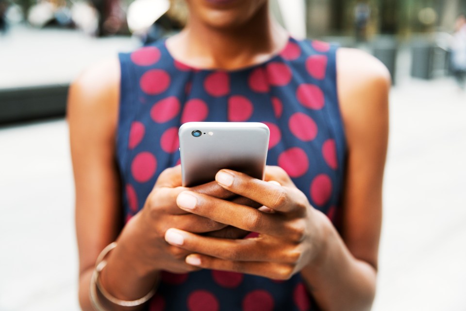 Close-up of a woman using a smartphone.