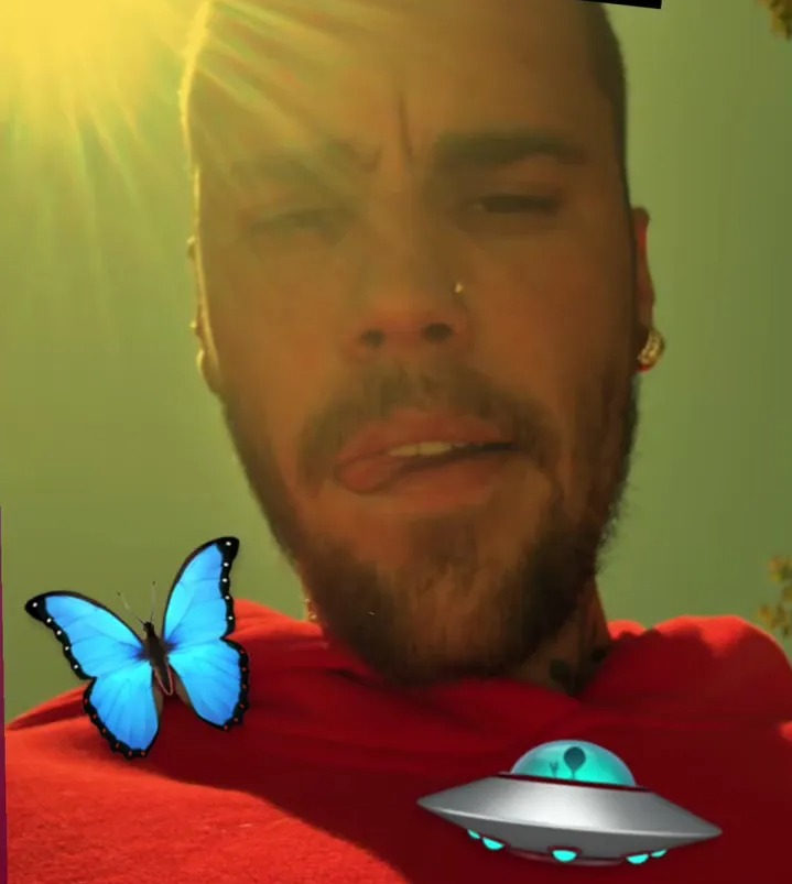 Justin Bieber selfie with added images of a heart-hands emoji, butterfly, and UFO.