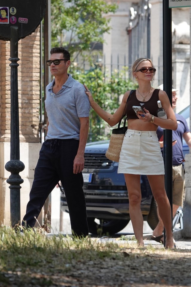 Ryan Seacrest and Camilla Orders walking in Rome.