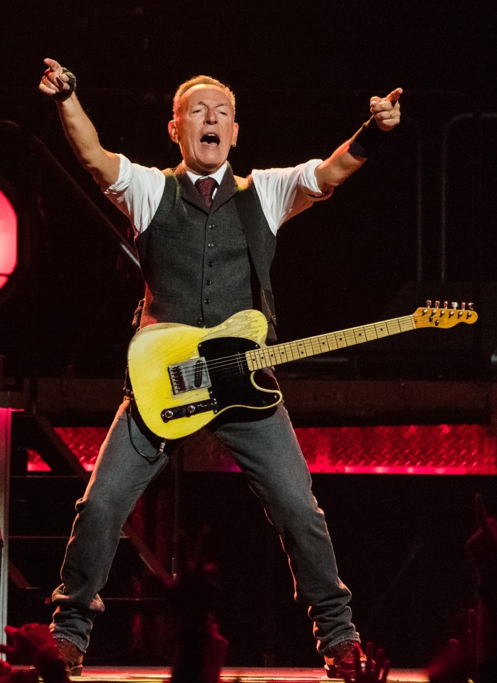 Bruce Springsteen performing with a guitar.