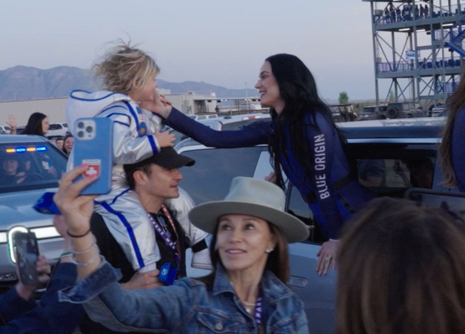 Katy Perry bids farewell to her daughter and husband before a space launch.