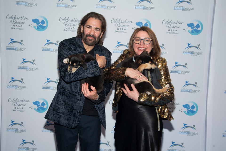 John M. Cusimano and Rachael Ray at the North Shore Animal League America Celebration of Rescue Gala, holding rescued puppies.