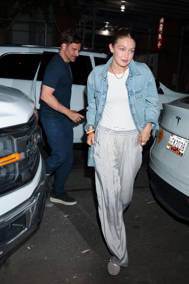 Gigi Hadid and Bradley Cooper leaving a restaurant.