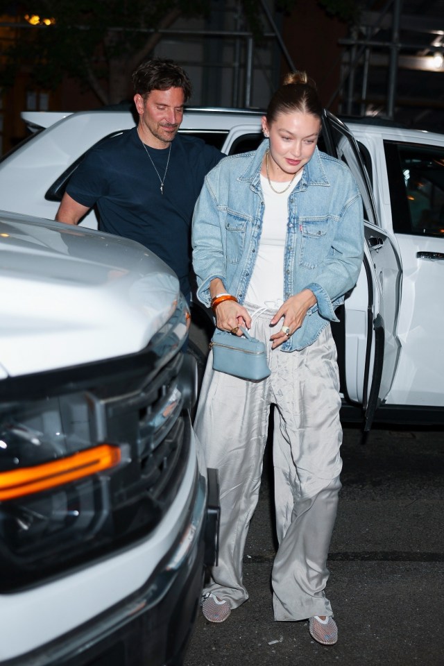 Gigi Hadid and Bradley Cooper leaving a restaurant.