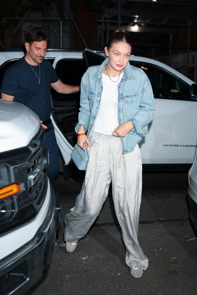 Gigi Hadid and Bradley Cooper leaving a restaurant.