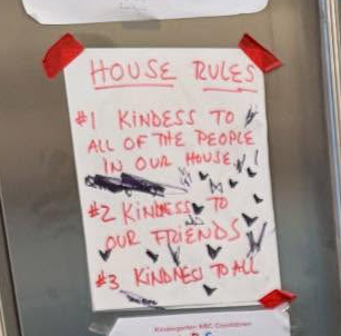 Handwritten house rules emphasizing kindness.