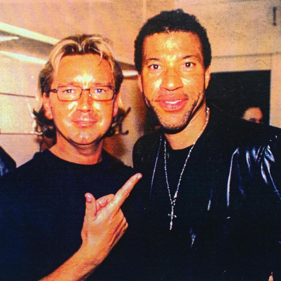 Photo of two men posing together.