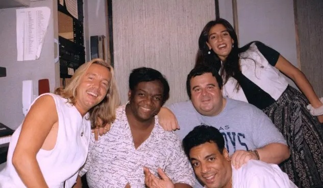 Group photo of Mary Kiani and DJ John Reid.