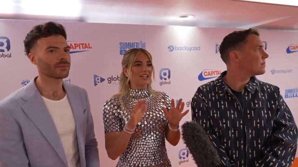 Three people being interviewed at the Capital Summertime Ball.