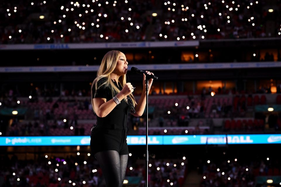 Mariah Carey performing at a concert.
