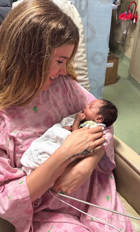 Joss Stone holding her newborn baby.