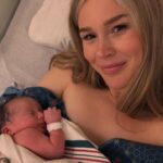 Joss Stone holding her newborn baby.