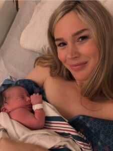 Joss Stone holding her newborn baby.