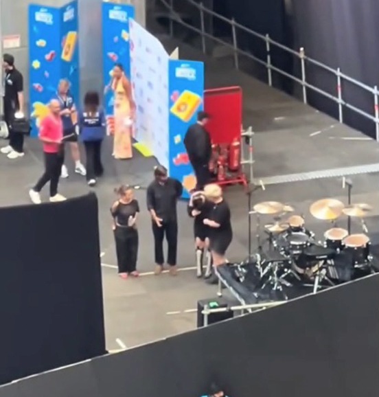 Singer Lola Young crying backstage after her earpiece malfunctioned.