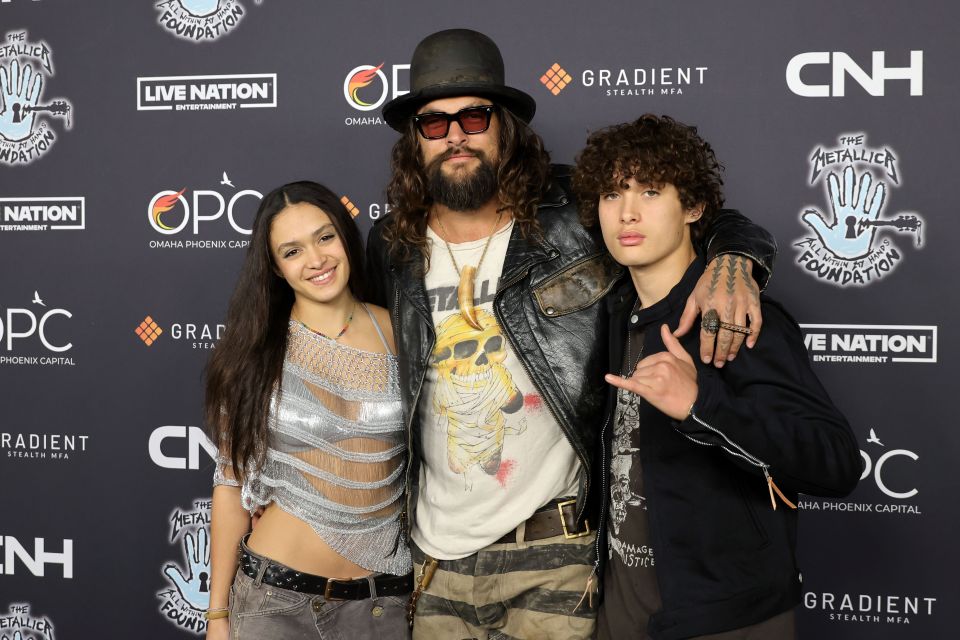 Jason Momoa with his children, Lola Iolani Momoa and Nakoa-Wolf Manakauapo Namakaeha Momoa, at an event.