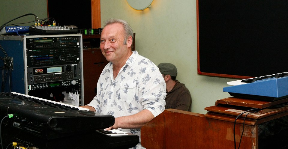 Jim Prime of Deacon Blue playing keyboards in a recording studio.