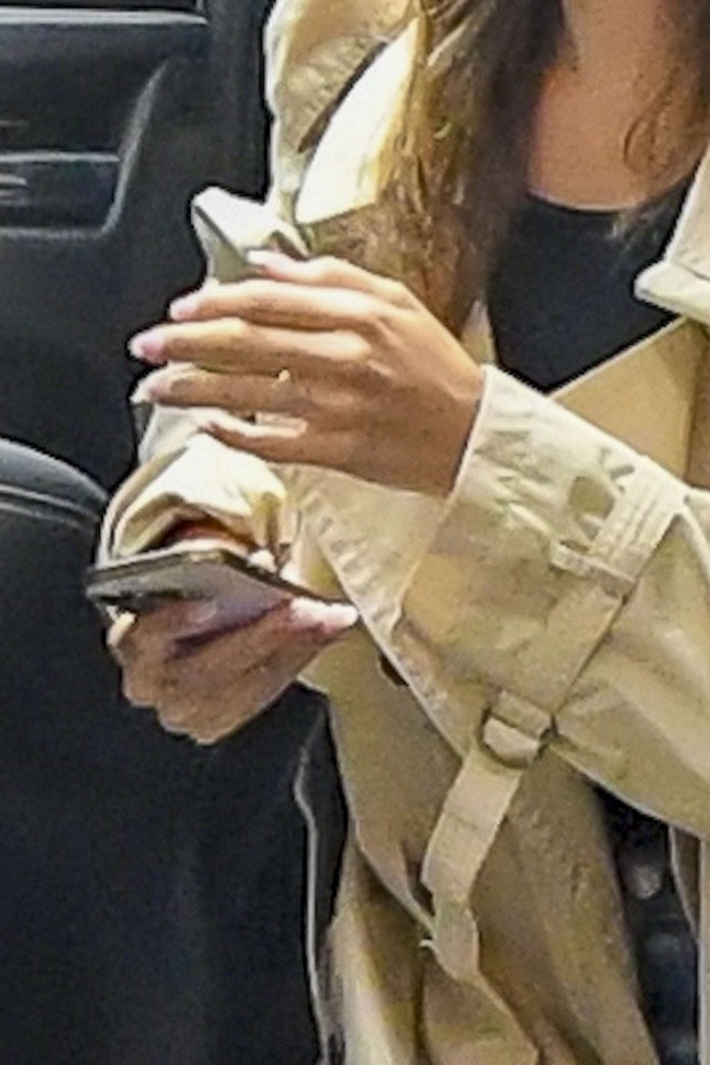 Hailey Bieber using a cell phone.