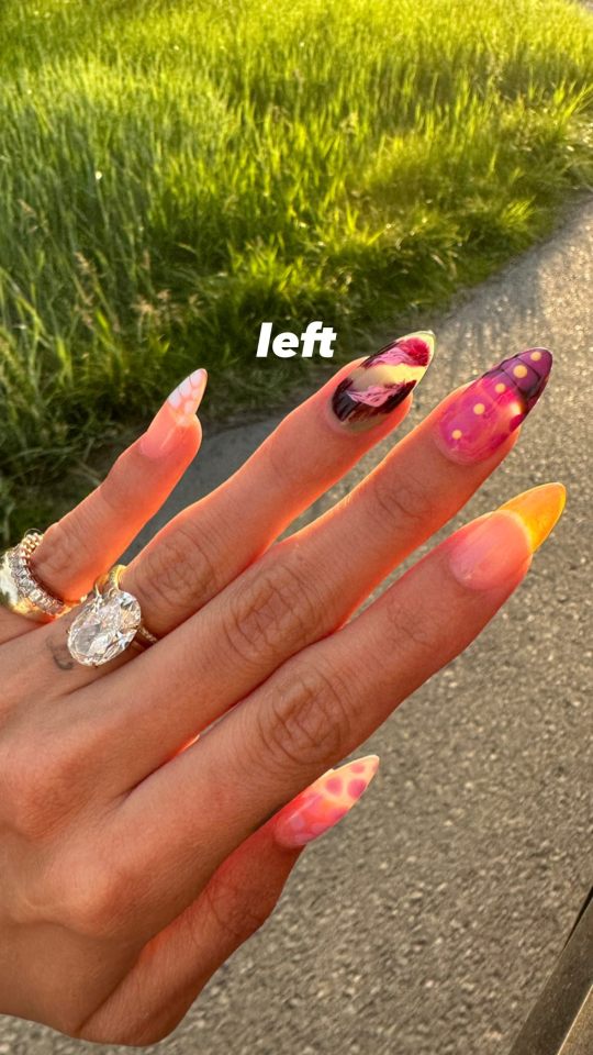 Close-up of Hailey Bieber's left hand showing off her engagement ring and nail art.