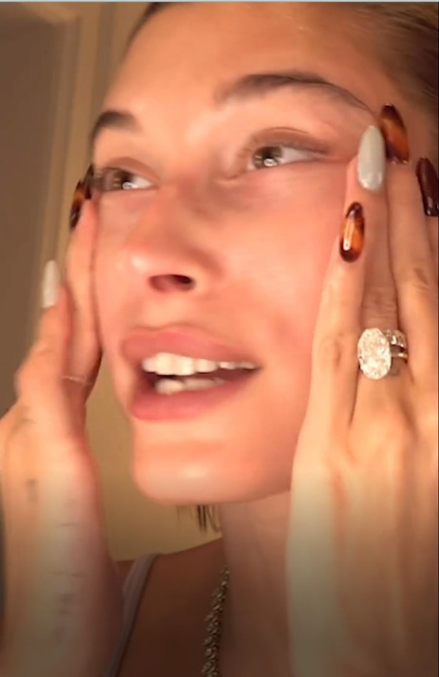 Hailey Bieber showing off her engagement ring.