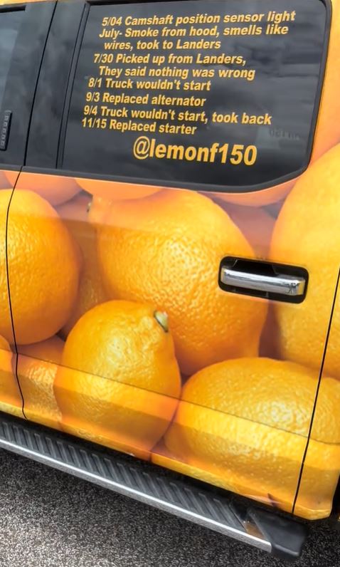 Ford truck with lemon wrap detailing repair history.