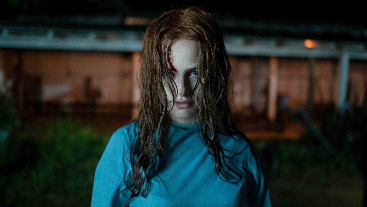 image of maya from the strangers: chapter 2 trailer in a hospital gown with a gash on her forehead
