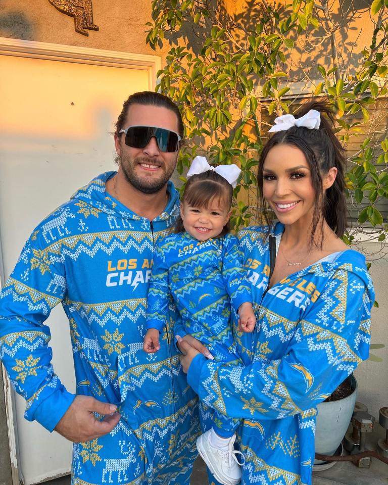 Family in matching Los Angeles Chargers pajamas.