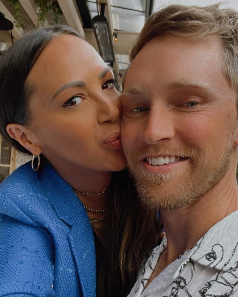 Close-up photo of Kristen Doute kissing her fiance Luke Broderick on the cheek.
