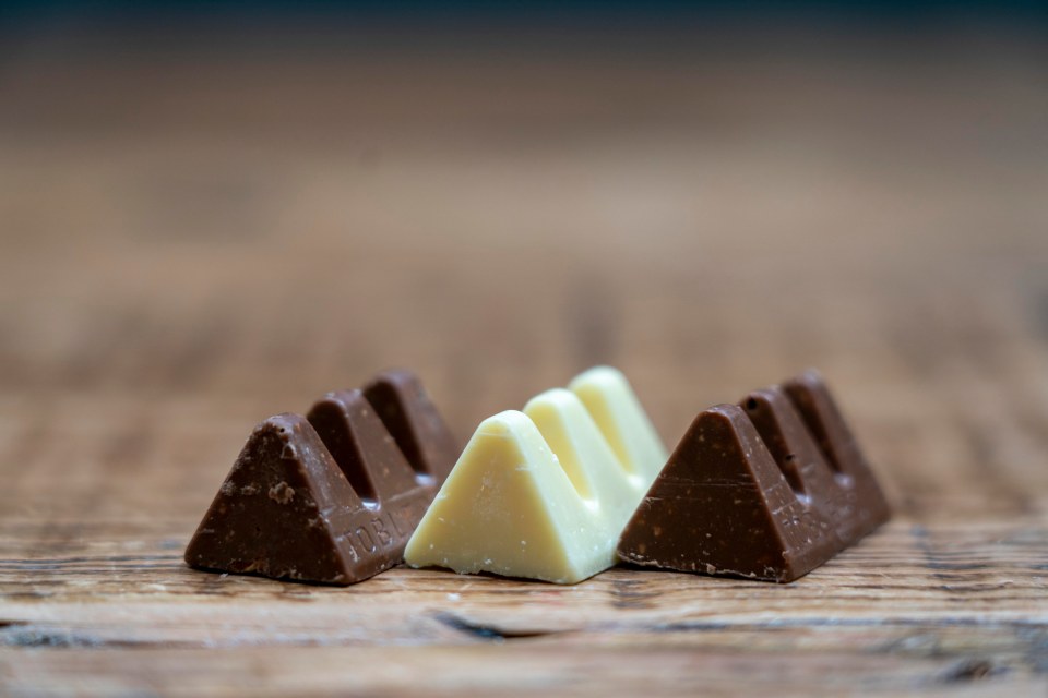 Milk chocolate and white chocolate Toblerone pieces.